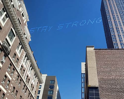 stay strong written in the sky over a city
